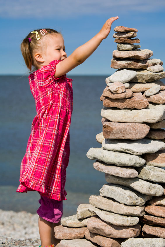 girl_stacking_rocks