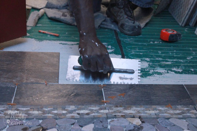 tile_setter_laying_floor