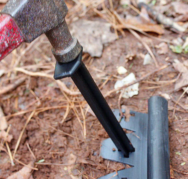 hammer stakes into edging