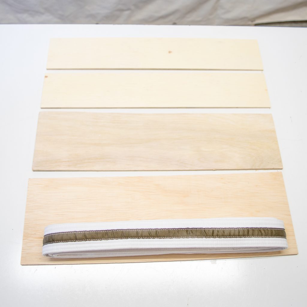 Measure your folded belt against the plywood to determine what size to cut.
