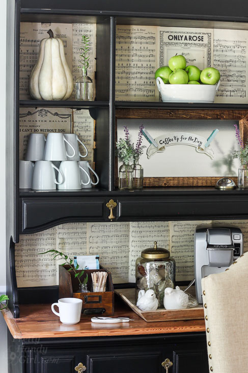 Coffee bar set up in dining room hutch