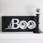 This black and silver Halloween sign is a spooky way to decorate for the holiday.