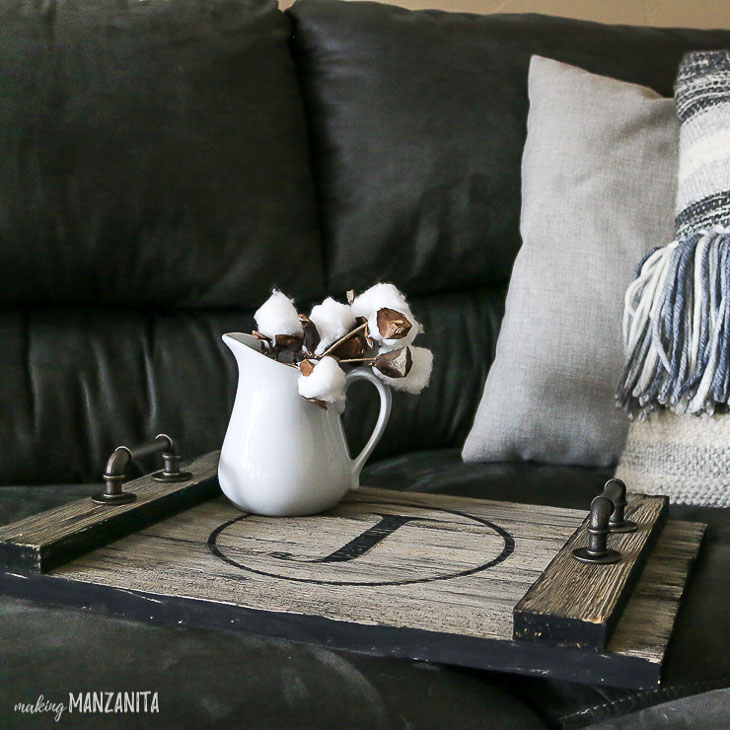 Farmhouse rustic wood serving tray on couch
