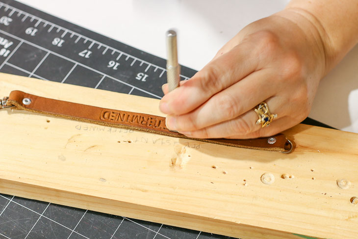 stamping letters into leather