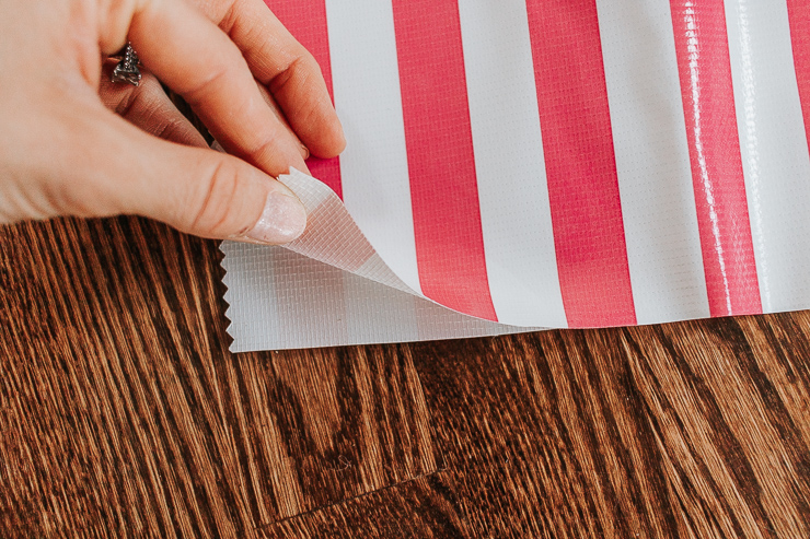Fold your oilcloth fabric in half
