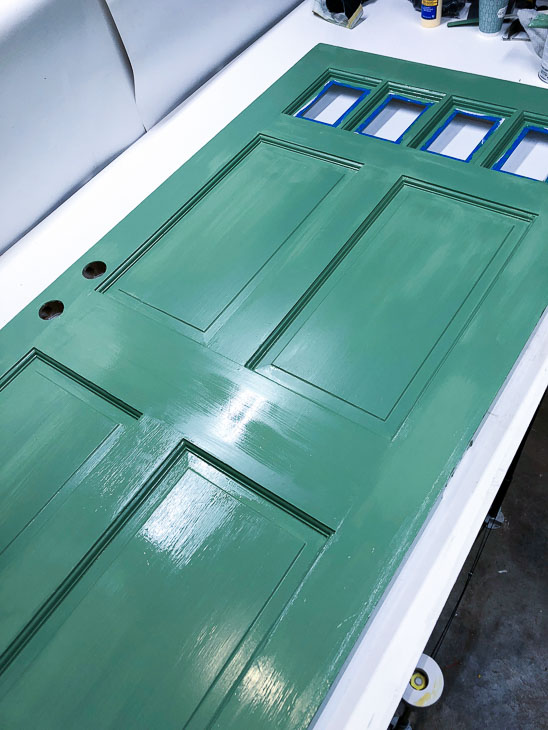 Paint repaired door with Magnolia Home Magnolia Green paint