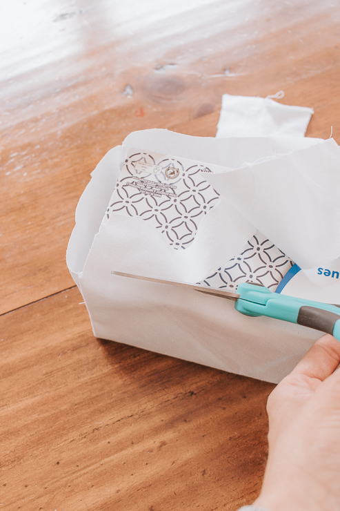 Trim excess fabric from tissue box cover