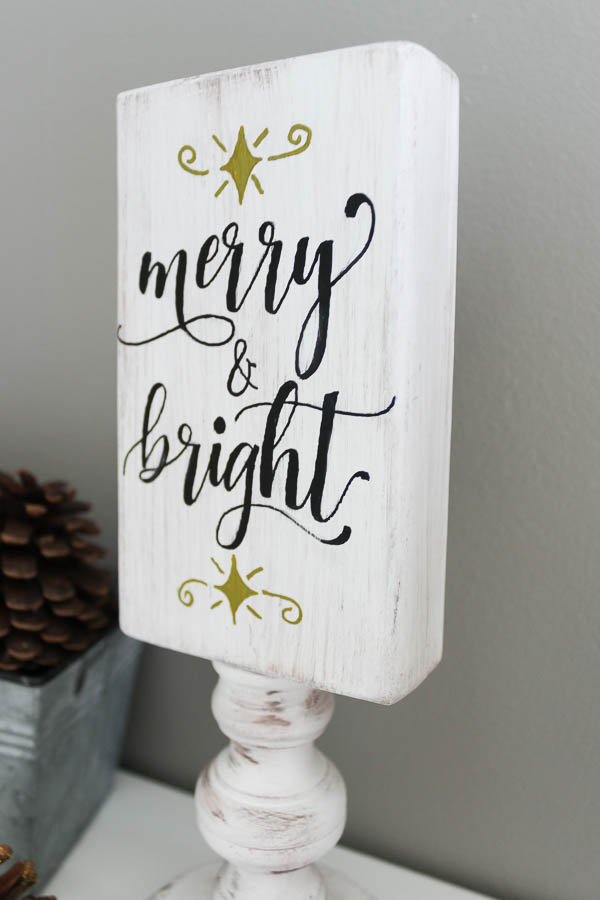 Merry and bright side on reversible wooden sign up close