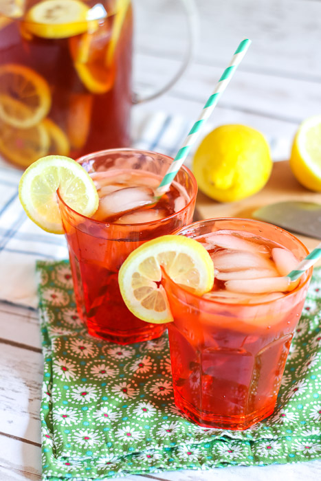 Sun tea in glasses topped with lemon slices